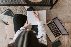 journalist writing in pad