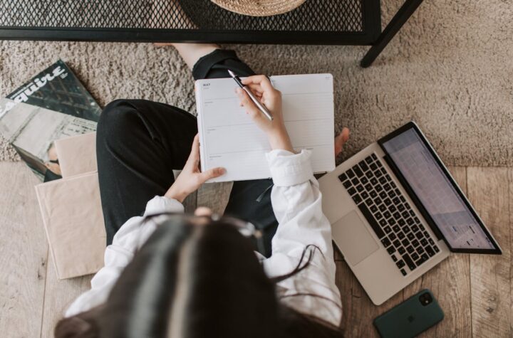journalist writing in pad
